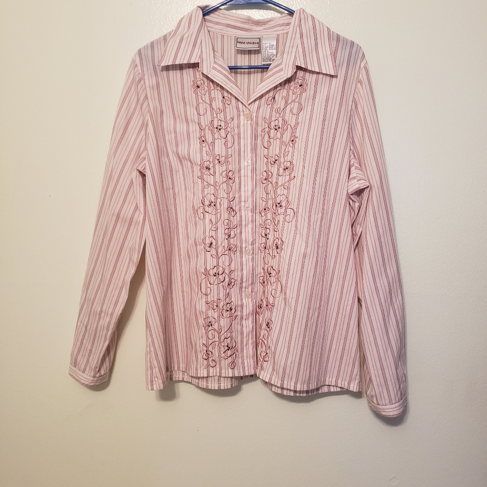 Long sleeve embroidered button up ladies blouse.
